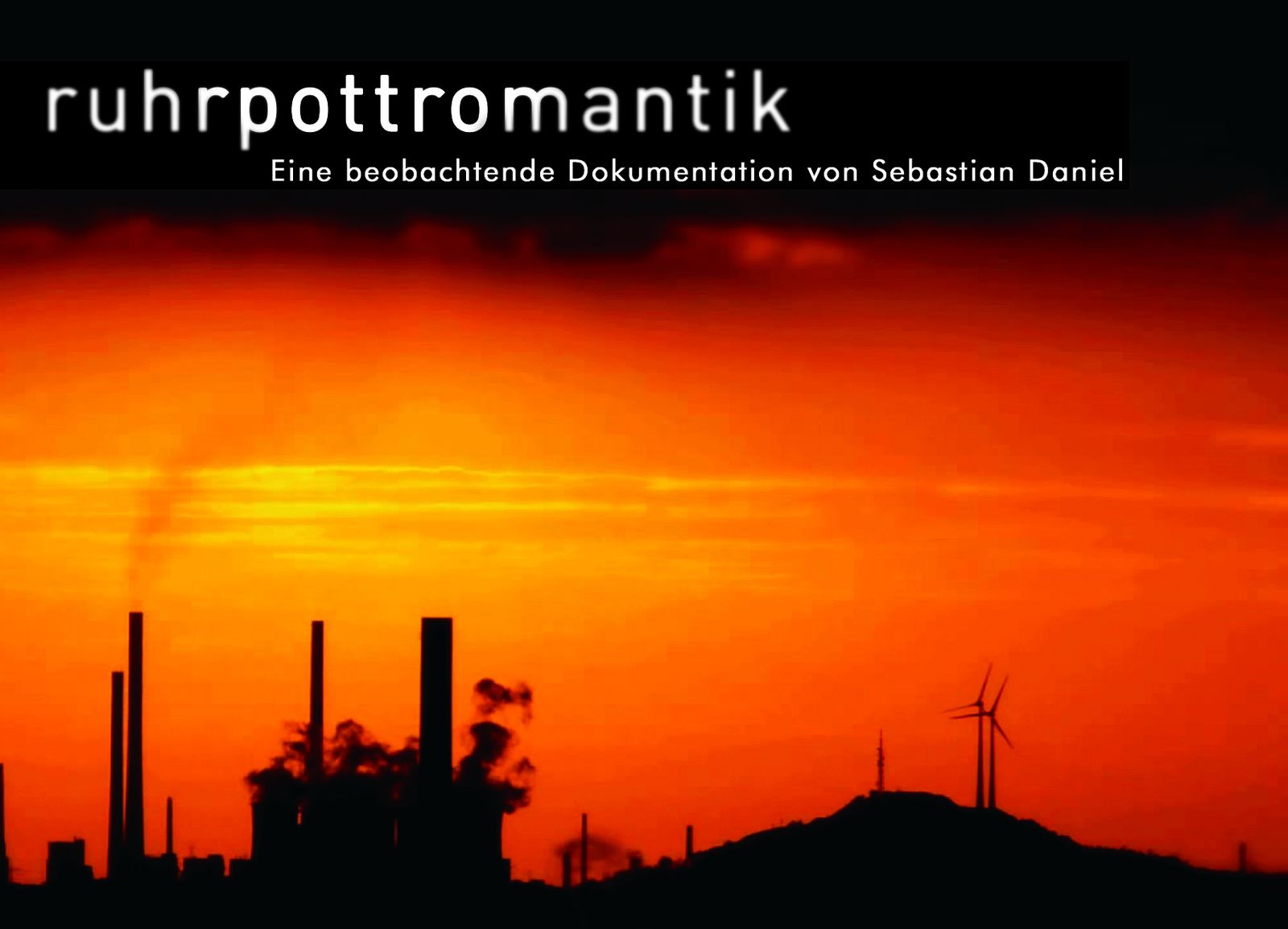 Standbild aus „ruhrpottromantik“: Industriekulisse im Ruhrgebiet bei Sonnenuntergang mit Windrad